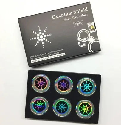 Box of six round gold and silver anti-radiation stickers for mobile phones.