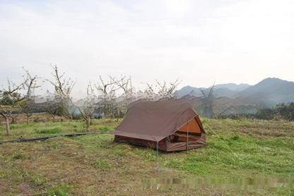 Brown and white portable A-line camping tent set up with hiking poles, showing its spacious interior for 2-3 people.