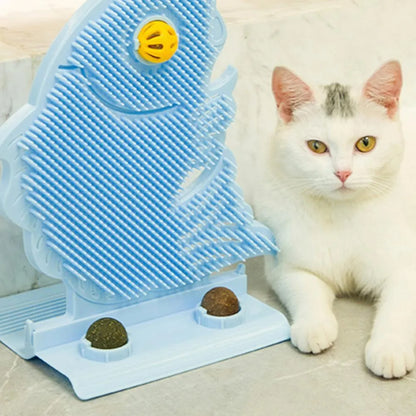 Blue fish-shaped cat wall scratcher with grooming brush, two catnip balls, and bell on white base