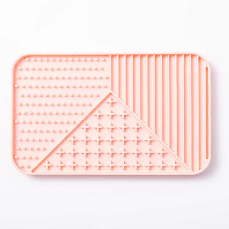 Silicone pet licking mat with suction cup base in pink, grey, or khaki colour options for slow feeding dogs and cats.