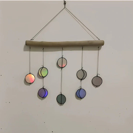Rainbow coloured moon phase wall decoration with circular iron framework and hanging chain