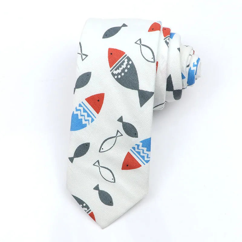 A narrow Korean-style cotton bow tie featuring a cartoon print, shown in a selection of colours.