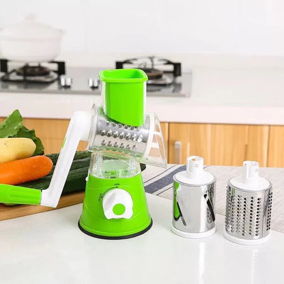 Hand drum rotary grater with handle and food-grade stainless steel blades, shown in Blue, Green or Red for cutting carrots and potatoes.