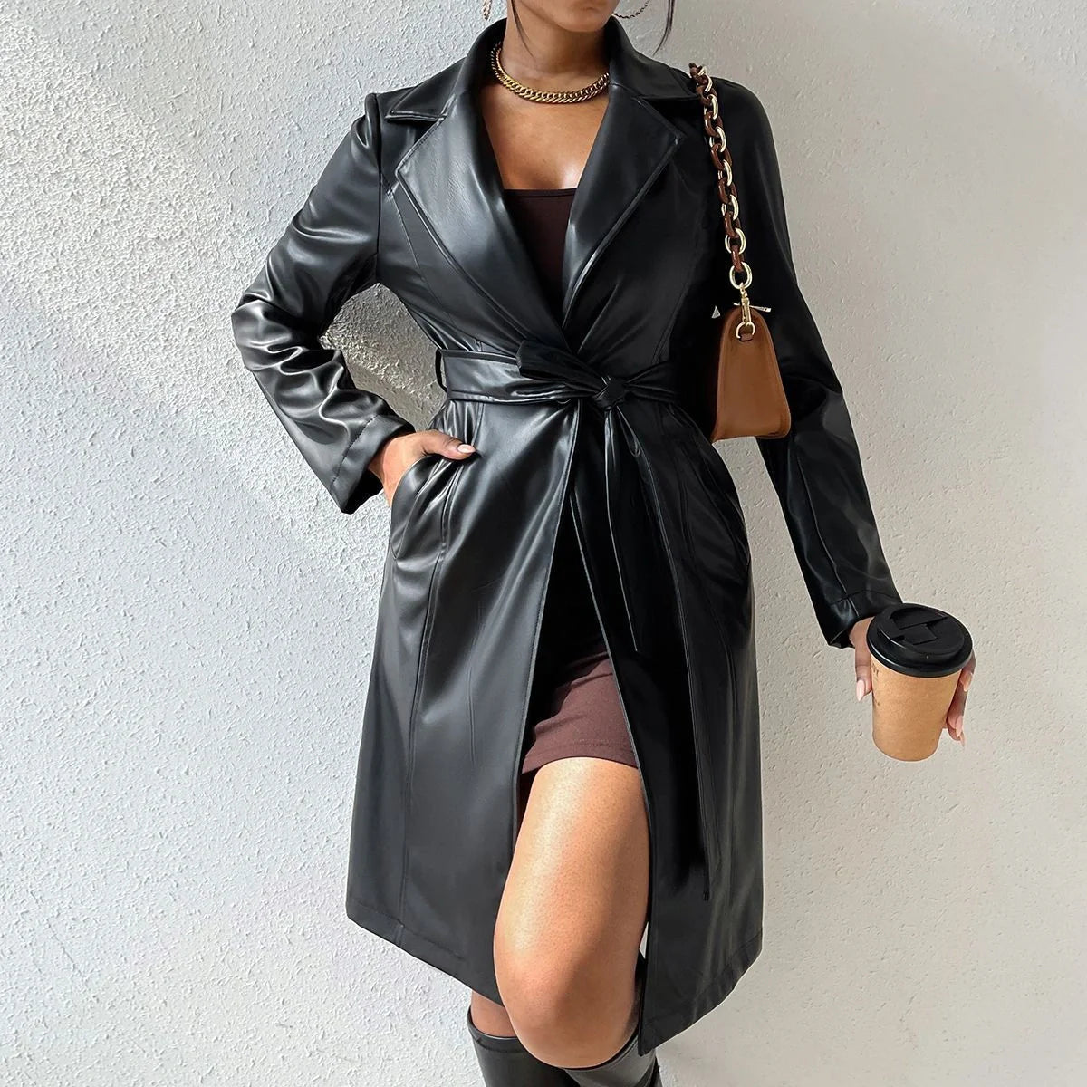 Women's long sleeve faux leather trench coat in various colors with pockets and slim fit design