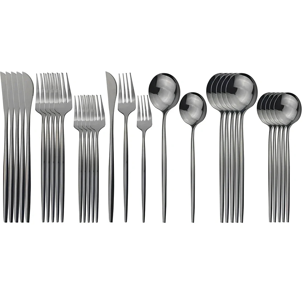 36-piece stainless steel cutlery set with mirror-polished table knives, forks, spoons, dessert forks, and dessert spoons arranged for six place settings