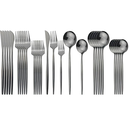 36-piece stainless steel cutlery set with mirror-polished table knives, forks, spoons, dessert forks, and dessert spoons arranged for six place settings