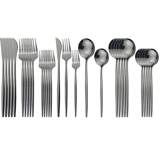 36-piece stainless steel cutlery set with mirror-polished table knives, forks, spoons, dessert forks, and dessert spoons arranged for six place settings