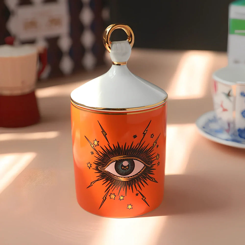 Blue ceramic candle holder with figure decals measuring 15cm high