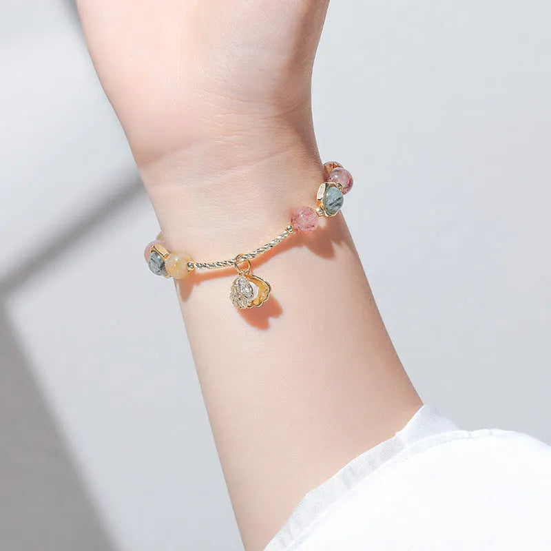 Women's cartoon style crystal bracelet with colourful hair crystal shell and red sealant flower shell designs