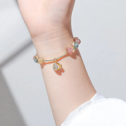 Women's cartoon style crystal bracelet with colourful hair crystal shell and red sealant flower shell designs