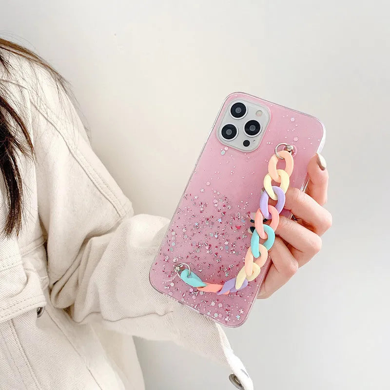 Silicone soft cover phone case with bracelet starry design in transparent, black, pink, or green for iPhone 14 and 15