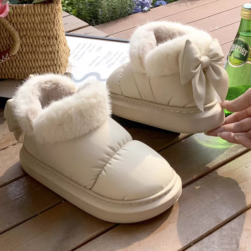 Women's winter ankle boots with non-slip sole and furry bow in white, khaki, and black