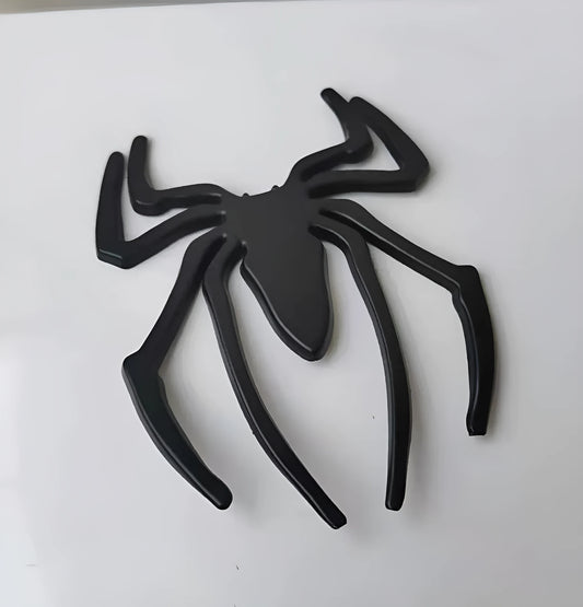 Three-dimensional metal spider bumper sticker in zinc alloy measuring 7cm by 5cm