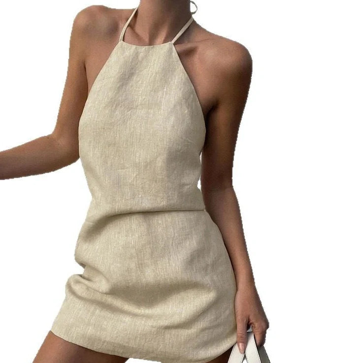 Women's solid colour linen A-line summer dress on hanger showing relaxed silhouette