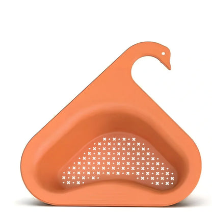Yellow swan-shaped plastic kitchen drainer basket with drainage holes on kitchen counter