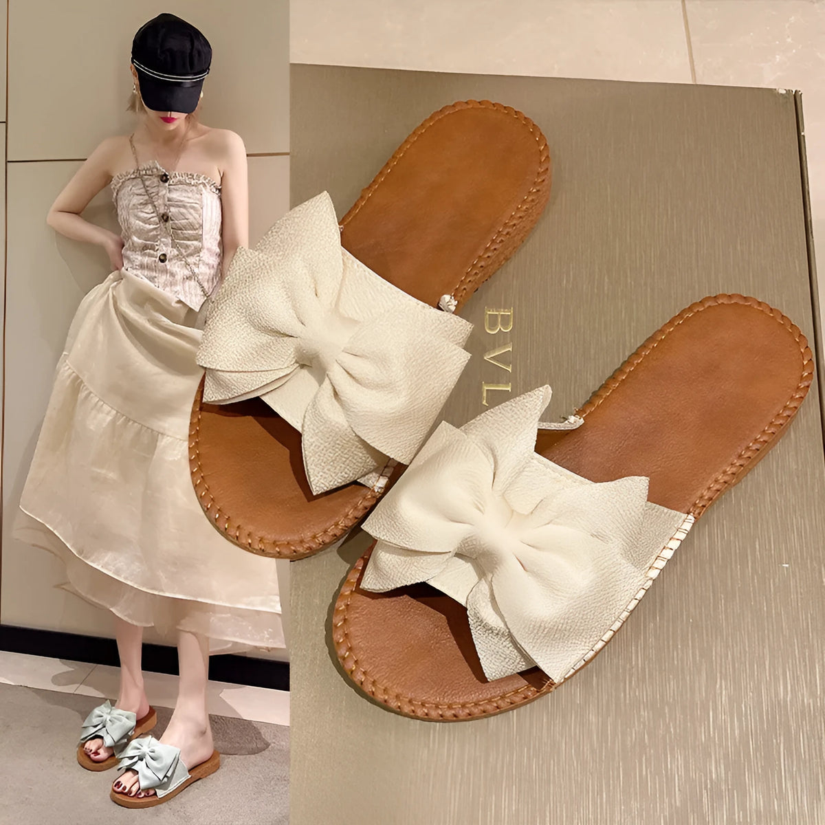 Women's beige suede slip-on sandals with a flat rubber sole and decorative bow.