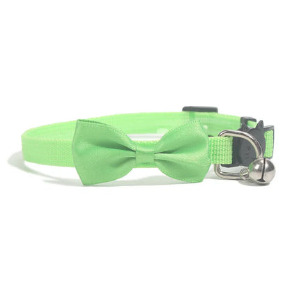 Striped nylon cat collar with decorative bow and bell in multiple colour options on a white background.