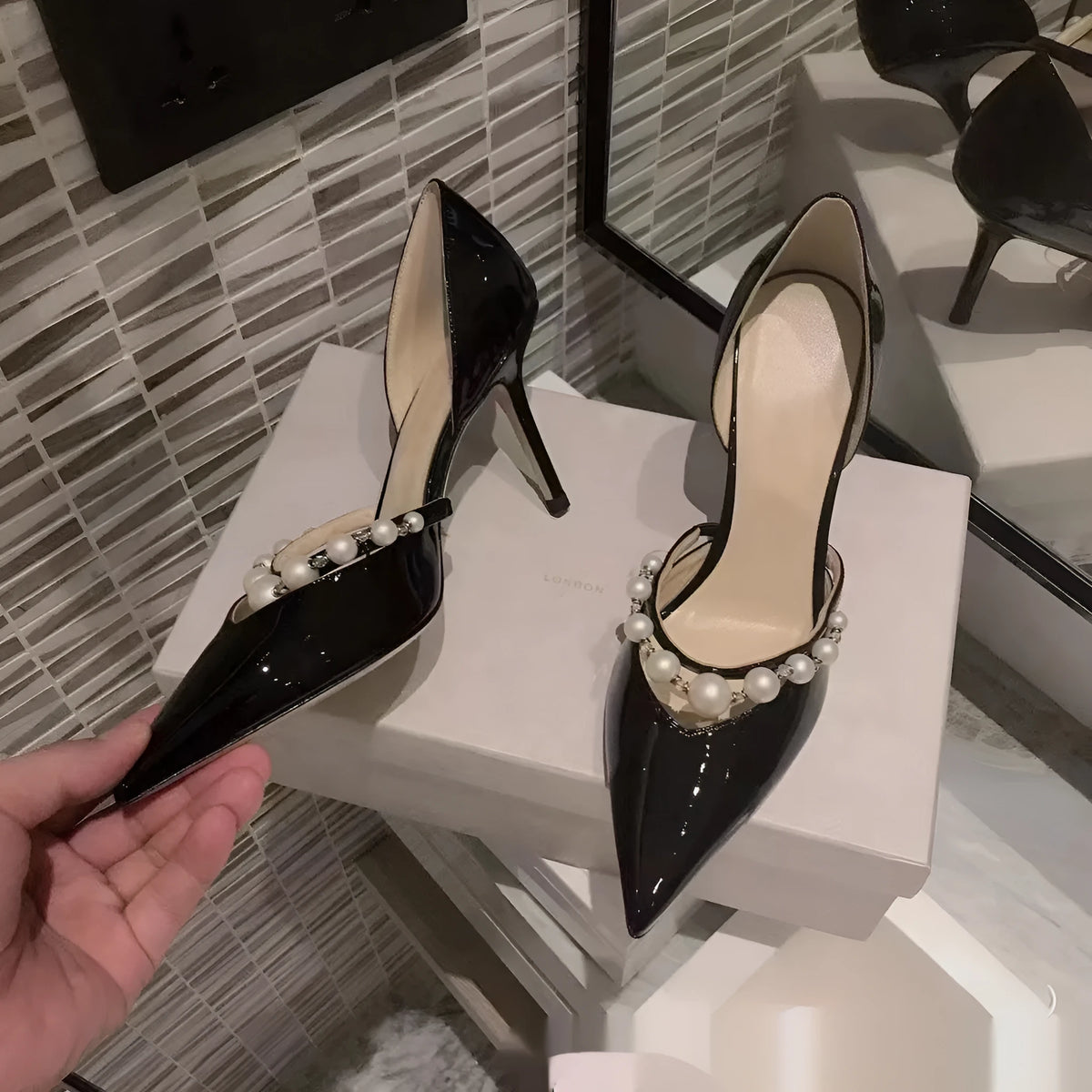 Women's pointed toe patent leather look stiletto high heels in nude, black or white with sheepskin lining.