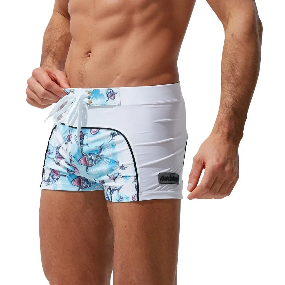 Men's nylon boxer shorts with floral and shark print designs showing deep purple, light purple, multicoloured options