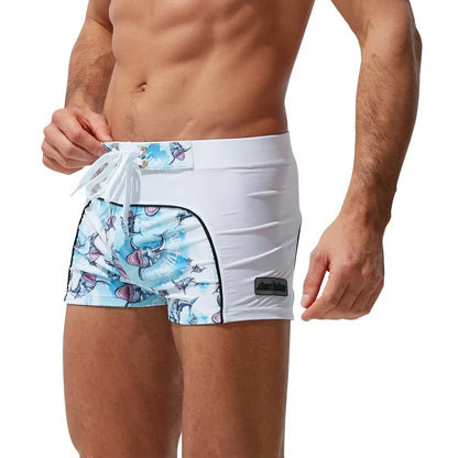 Men's nylon boxer shorts with floral and shark print designs showing deep purple, light purple, multicoloured options