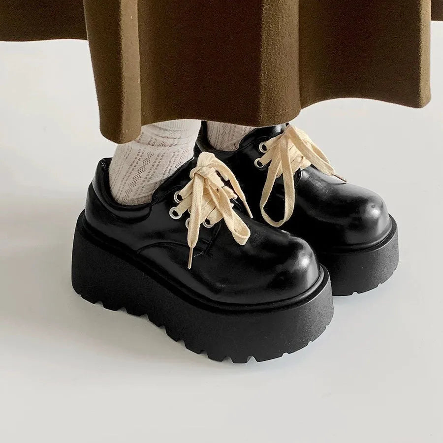 Women's black matte lace-up shoes with 6-8cm English muffin heel and round toe, shown on a neutral background