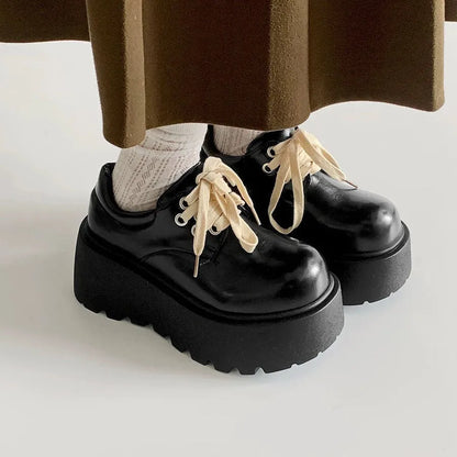 Women's black matte lace-up shoes with 6-8cm English muffin heel and round toe, shown on a neutral background