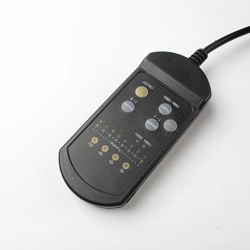 Black heating massage mat with infrared function and a seat cushion on a floor