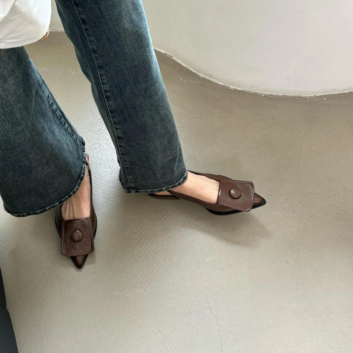 Women's low-heel pointed toe sandals with a back strap in black, brown, apricot, and silver colours.