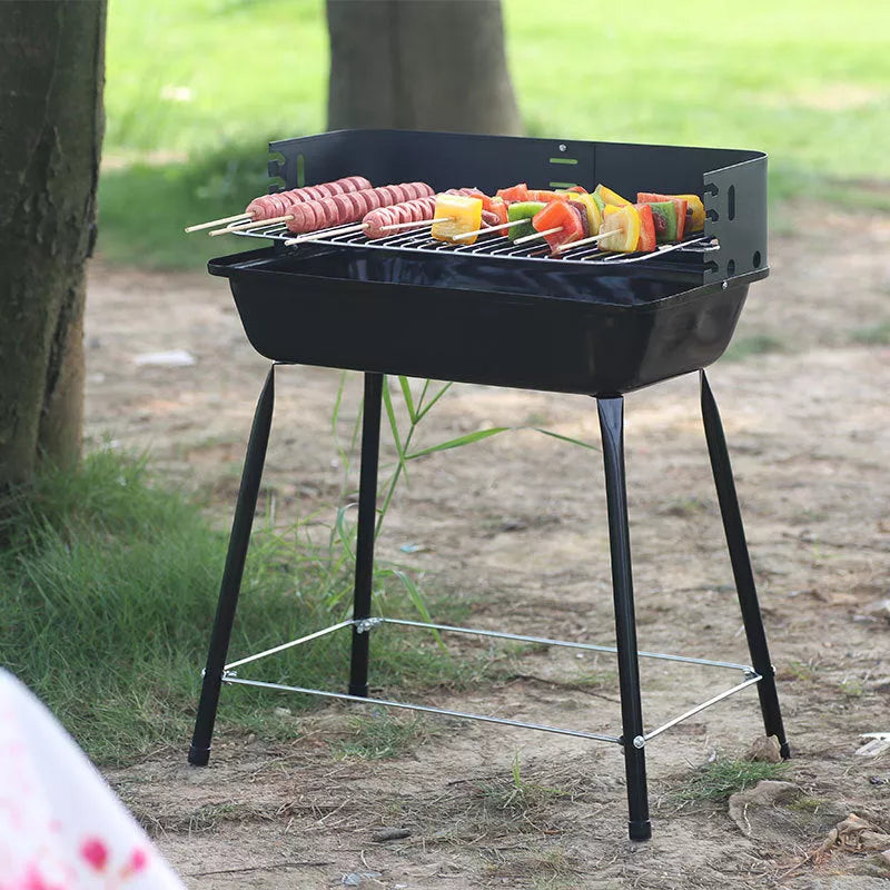 Portable outdoor barbecue oven with metal grill for camping and outdoor use