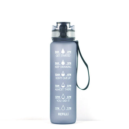 Transparent 1000ml Tritan sports water bottle with infuser on a plain background