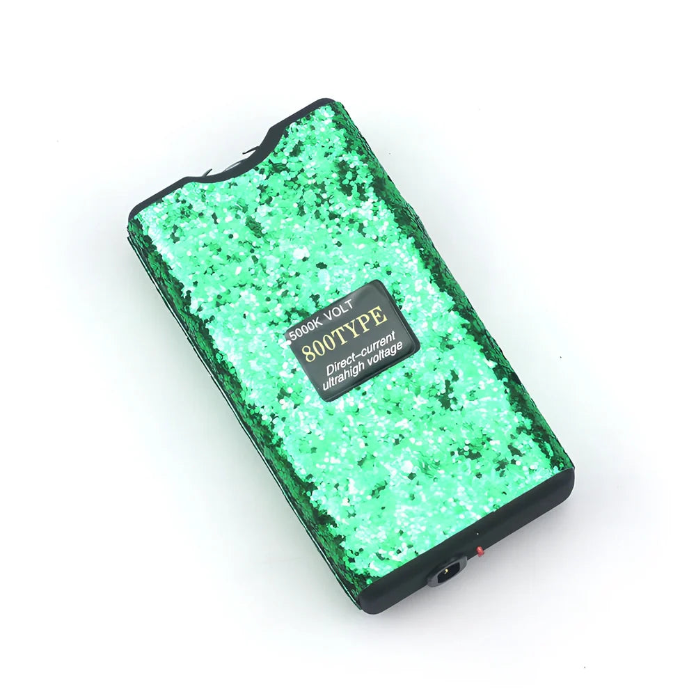 Purple self-defence torch with 100-lumen LED and emergency alarm function measuring 15cm