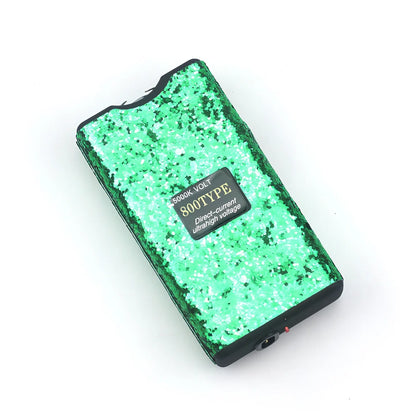 Purple self-defence torch with 100-lumen LED and emergency alarm function measuring 15cm