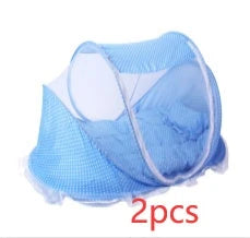 Portable foldable baby bed net with built-in mattress and pillows, perfect for travel and outdoor activities