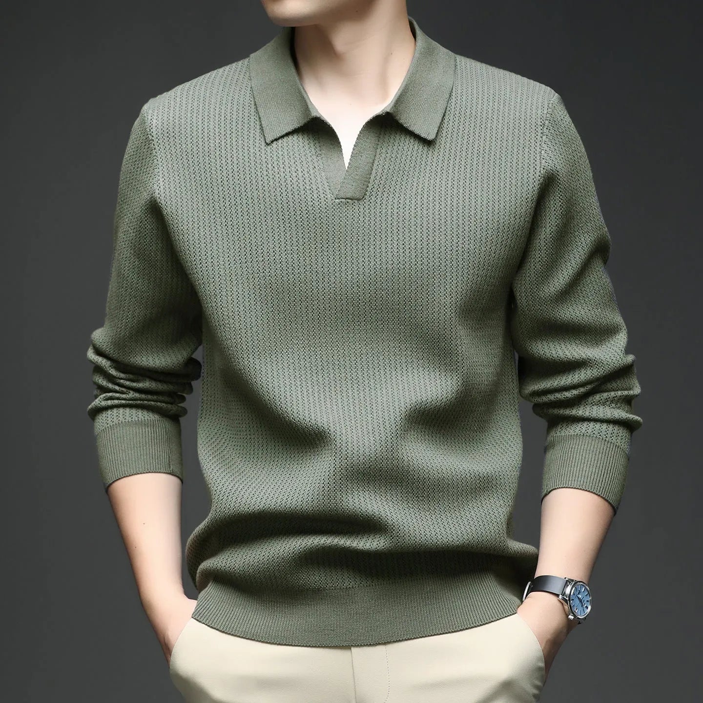 Man wearing a loose fit camel coloured pullover sweater, a casual autumn layer with a simple design.