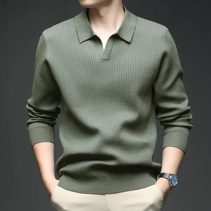 Man wearing a loose fit camel coloured pullover sweater, a casual autumn layer with a simple design.