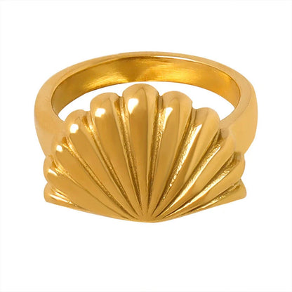 Elegant scallop-inspired titanium steel ring in steel or gold finish, available in sizes 6, 7, and 8, featuring a unique geometric design for a stylish and versatile accessory.