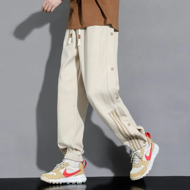 Men's loose fit ankle-tied sweatpants in a cotton blend fabric on a neutral background