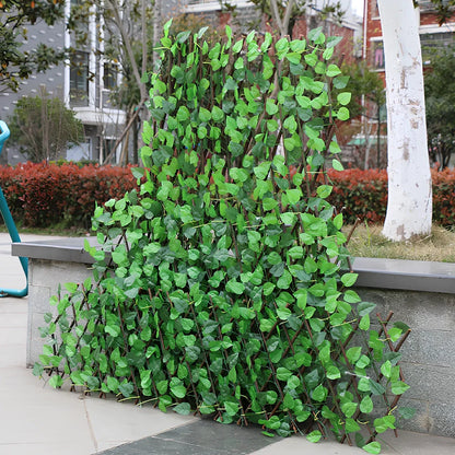 Plastic simulation wooden fence panel showing realistic wood grain texture in outdoor setting