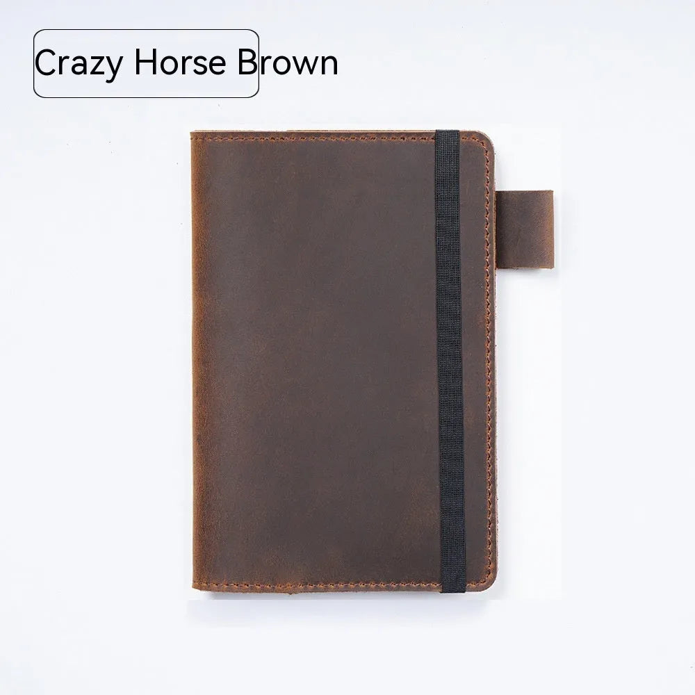Handmade cowhide kraft notebook open showing wood-free paper, in dark green colour