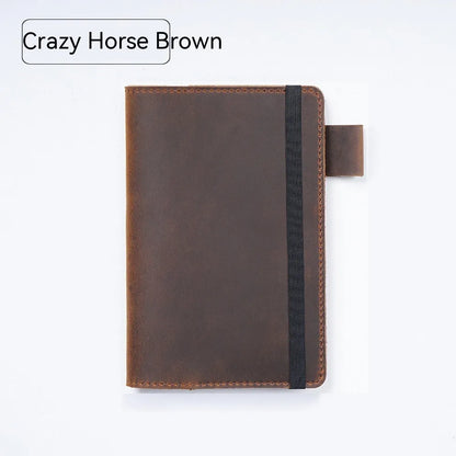 Handmade cowhide kraft notebook open showing wood-free paper, in dark green colour