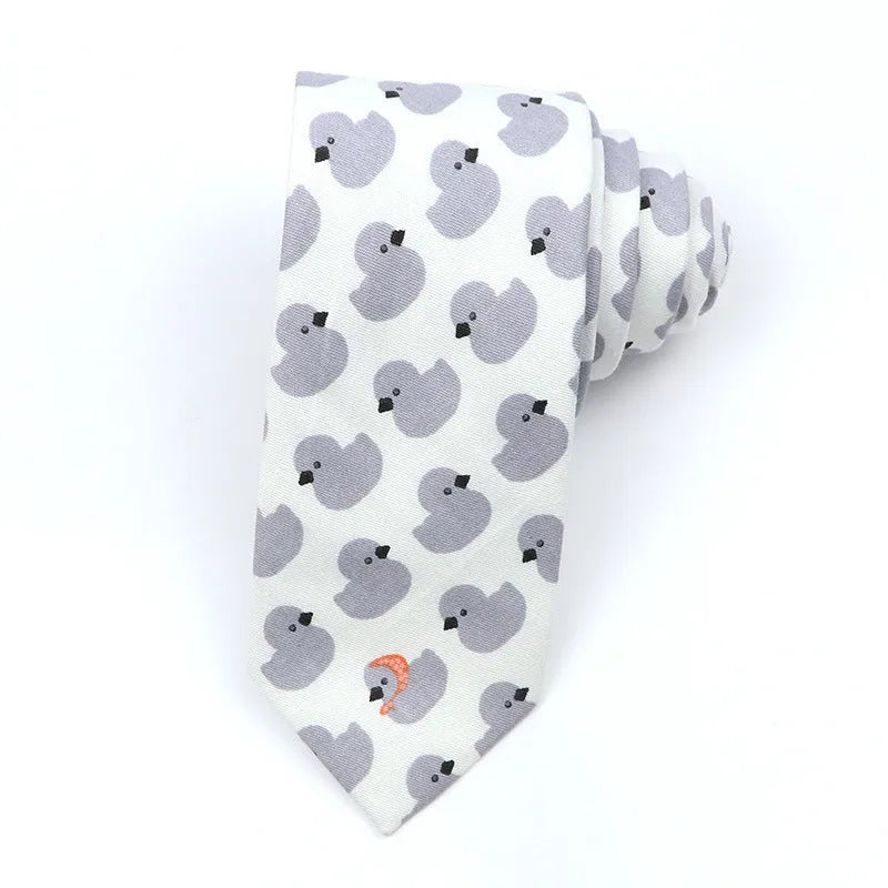 A narrow Korean-style cotton bow tie featuring a cartoon print, shown in a selection of colours.