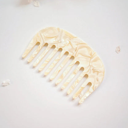 Retro acetate hair comb in cherry blossom powder colour showing 10x6.2cm dimensions and rounded teeth