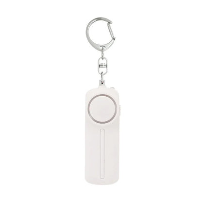 Compact pink self-defense alarm showing 86mm length with activation button and LED light