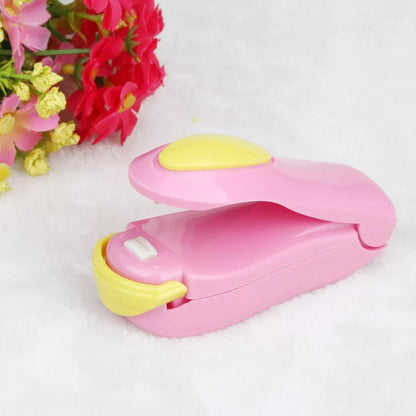 Mini hand pressure heat sealing machine measuring 10cm with magnetic base for plastic bag food preservation