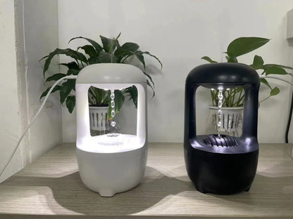 White anti-gravity humidifier showing upward water droplets with 500ml tank and USB-C cable