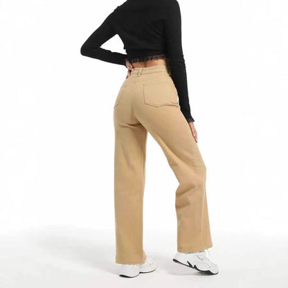 Women's autumn straight jeans in apricot colour showing high waist design and wide leg cut on mannequin