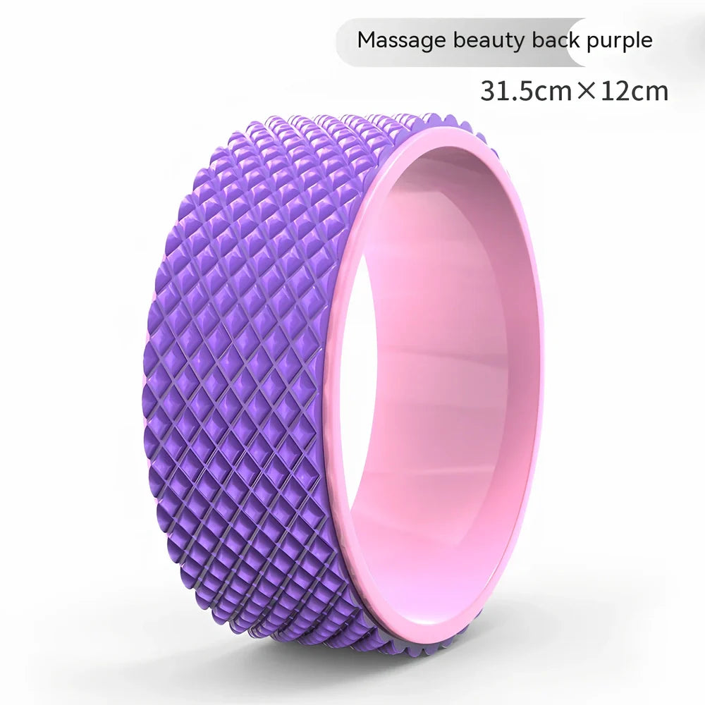 Pink yoga wheel with 31.5cm diameter and 12.2cm width for back-bending exercises