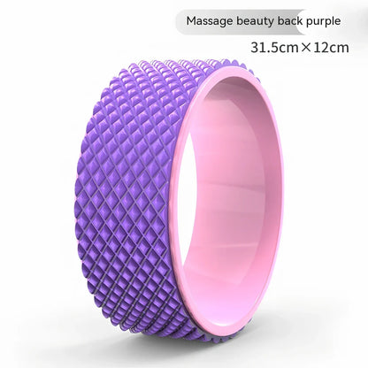 Pink yoga wheel with 31.5cm diameter and 12.2cm width for back-bending exercises