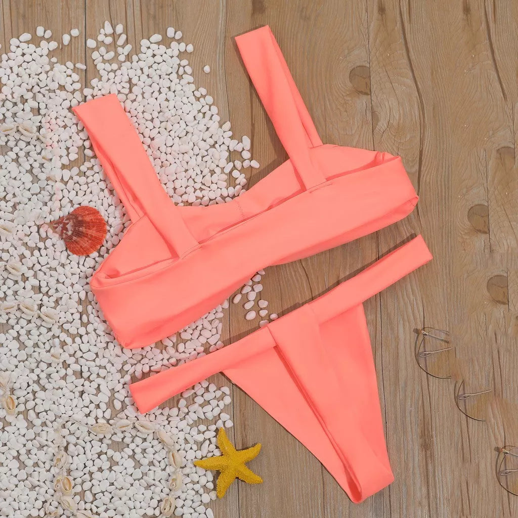 Solid color split bikini swimsuit in orange with nylon fabric and polyester lining