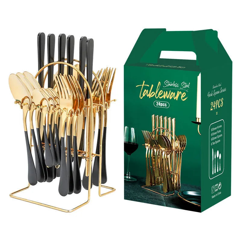 24-piece stainless steel cutlery set with knives, forks, spoons, and teaspoons on a storage rack in a gold finish.